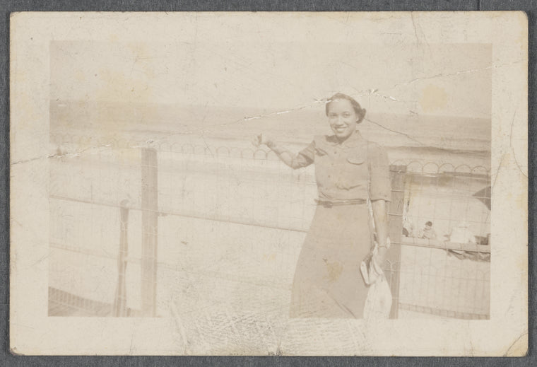 Woman standing on boardwalk
