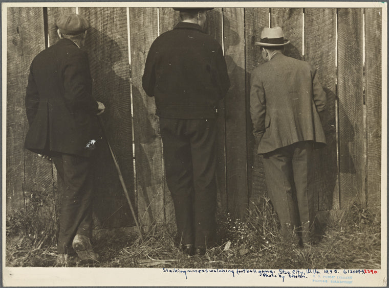 Watching a football game, Star City, West Virginia