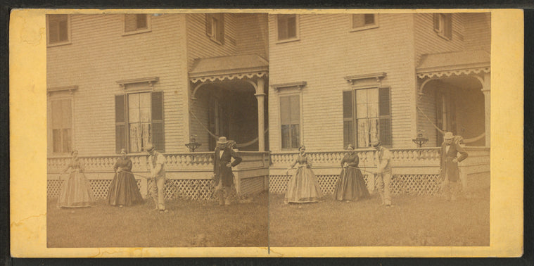 View of men & women playing croquet in the lawn.