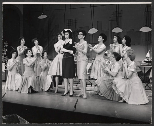 Bonnie Scott, Claudette Sutherland [center] and ensemble in the stage production How to Succeed in Business Without Really Trying