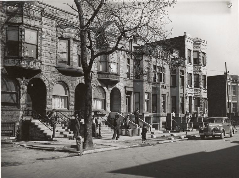 Old brown stonehouses now occupied by Negroes in Chicago, Illinois, April 1941.