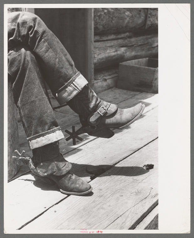 Detail of farmer's blue jeans, boots and spurs. This man was once a cowboy and still prefers the cowboy's dress, Pie Town, New Mexico