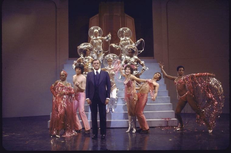 Actor Pat Hingle (C) with cast members in a scene from the Broadway musical "The Selling Of The President" (New York)