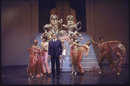 Actor Pat Hingle (C) with cast members in a scene from the Broadway musical "The Selling Of The President" (New York)