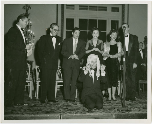 At extreme left, Mark Dawson (Bob), at center, Bill Hayes (Larry) and Isabel Bigley (Jeanie) and others at "stunt" birthday celebration for Me and Juliet