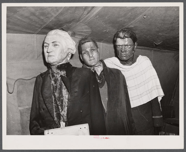 Effigies of Washington, Joe Louis and some criminal in a travelling sideshow "crime museum". Washington and Joe Louis are examples of "what you may become if you go straight". Near Fort Bragg, North Carolina