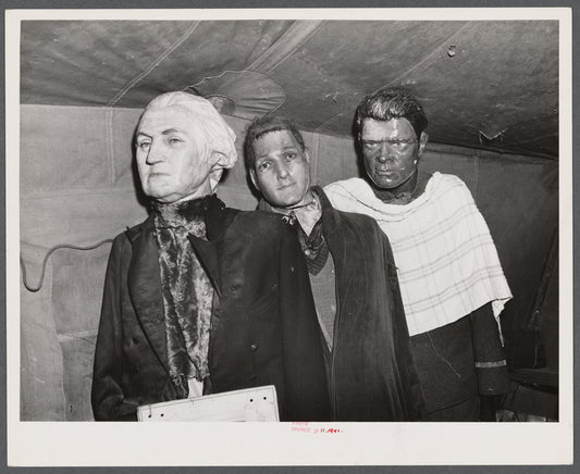 Effigies of Washington, Joe Louis and some criminal in a travelling sideshow "crime museum". Washington and Joe Louis are examples of "what you may become if you go straight". Near Fort Bragg, North Carolina