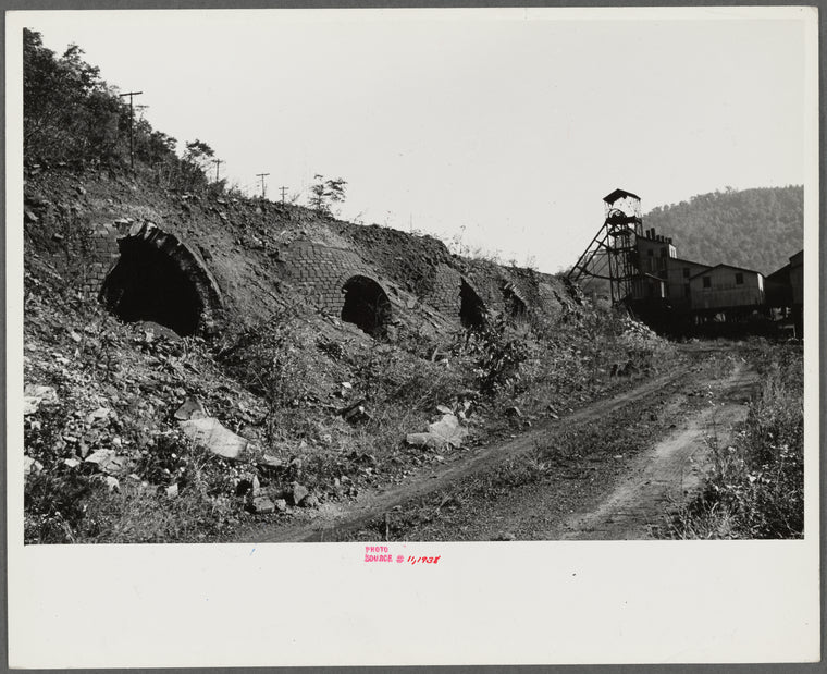 Old abandoned coke ovens with mine tipple in background, Maitland, West Virginia