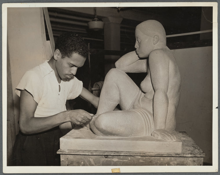 Francisco Lord working on sculpture