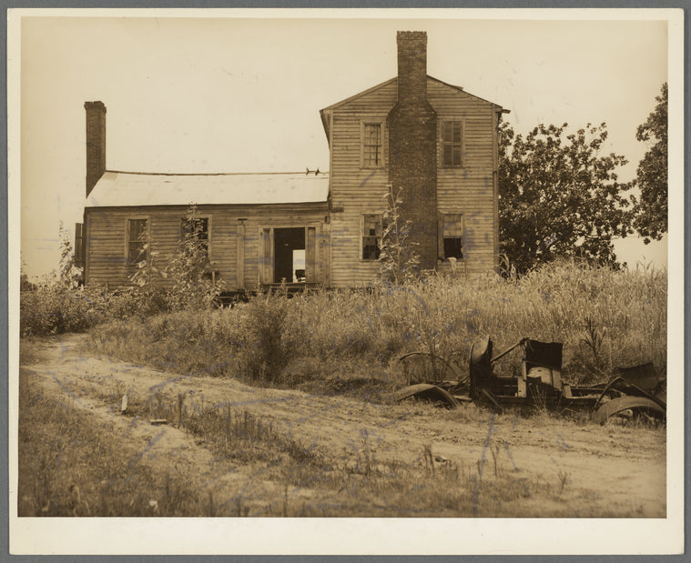 A plantation house decaying and now vacant but for two rooms occupied by an old couple, Negro tenants. Greene County, Georgia