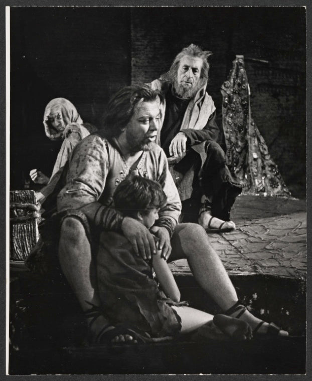 Douglas Campbell [seated center facing forward] and unidentified others in the stage production Gideon