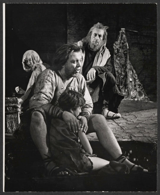 Douglas Campbell [seated center facing forward] and unidentified others in the stage production Gideon