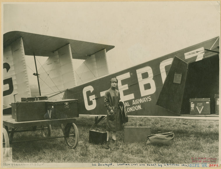 Woman in leather coat standing in front of an Imperial Airways aircraft at Le Bourget, Paris.