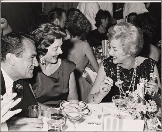 Myrna Loy and Margaret Leighton in a candid photograph on opening night of the original Broadway production of Noël Coward's "Sail Away"