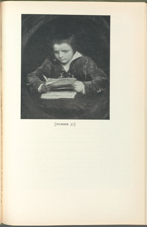 A boy holding a pen