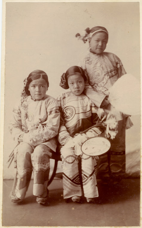 Chinese girls holding fans