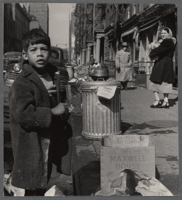 Street scene with young boy and passersby