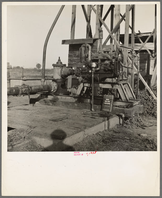 This pumping plant for irrigation is powered by a natural gas engine which operates on cost of about 1/2 the cost of electricity, Tulare County, California