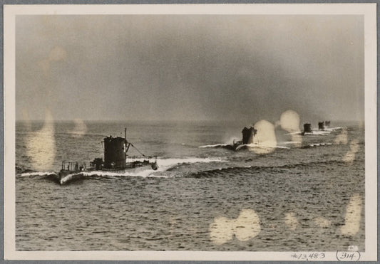 German submarines, which sometimes practice in the Baltic, passing in review in line-ahead (formation) before Grand Admiral Raeder.