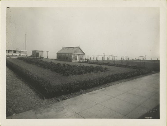 View of garden and greenhouse on Ellis Island.