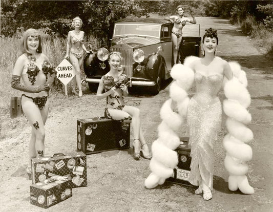 Gypsy Rose Lee on the road with Rolls Royce with Show Girls [curves ahead sign]