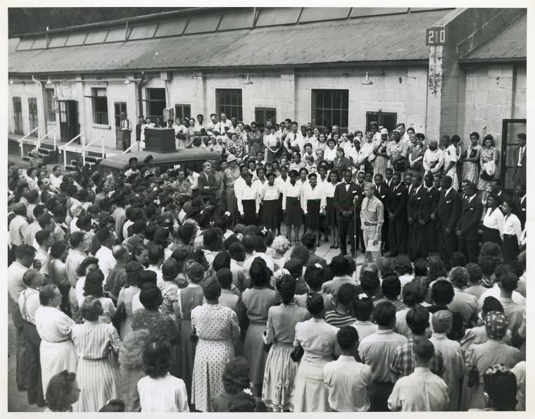 Workers at Labor Day exercises gather to hear a chorus of Arsenal workers sing spirituals; Picatinny Arsenal, Dover, N. J., 13 Dec. 1944