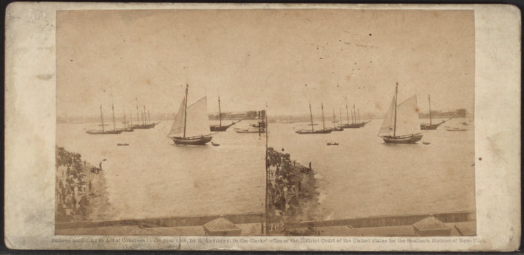 View in New York Harbor. Sloop sailing rapidly with reefed mainsail.