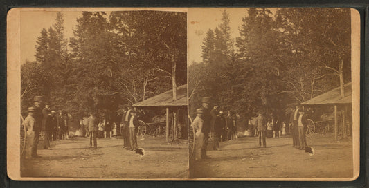 Group of men standing near an 'Eating Saloon'.