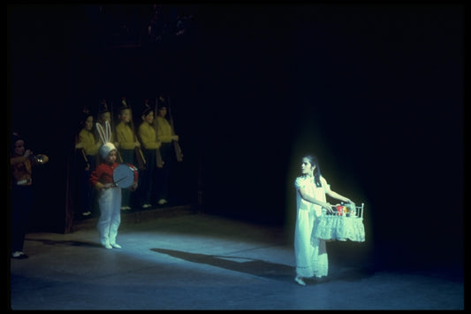 Mary carrying her Nutcracker to safety, in a New York City Ballet production of "The Nutcracker" (New York)