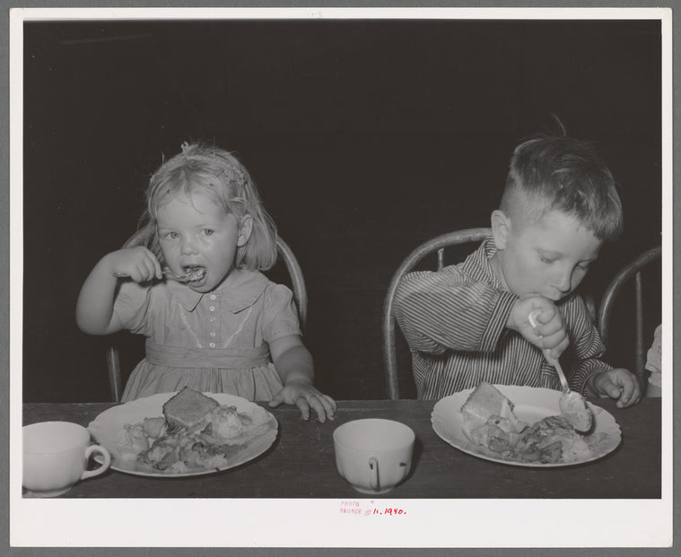 Children eating lunch at WPA (Work Projects Administration) nursery school at the Agua Fria migratory labor camp. Arizona