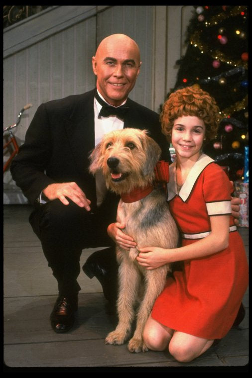 Roseanne Sorrentino as Annie and Harve Presnell as Daddy Warbucks w. Sandy in a scene from the touring company of the musical "Annie." (Louisville)