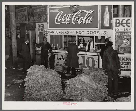 Lunch stand and tobacco inside entrance to warehouse at end of auction sale. Durham, North Carolina