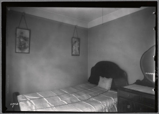 Bedroom, middle class apartment; view of bed and bureau: Manhattan