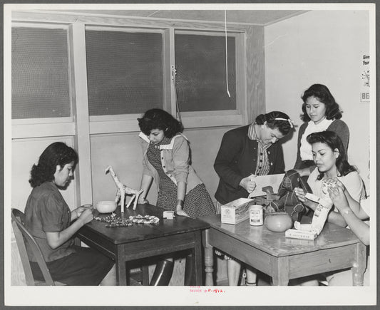 NYA (National Youth Administration) girls who live at the resident center at the FSA (Farm Security Administration) farm workers' community at Eleven Mile Corner, Arizona, learn to use waste materials for toys, jewelry, etc