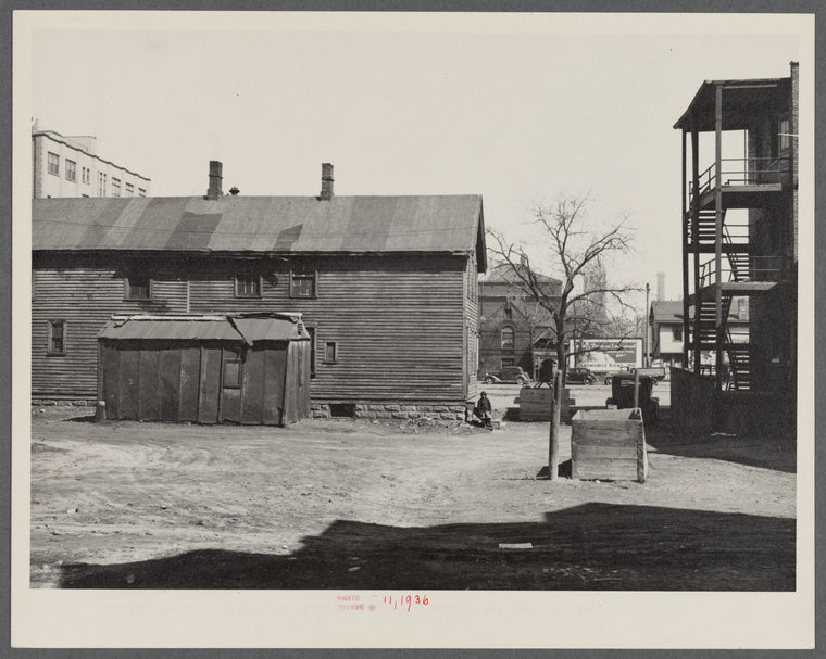 Exterior of house on alley between 7th and 8th and Milbourn and State Streets. Milwaukee, Wisconsin.