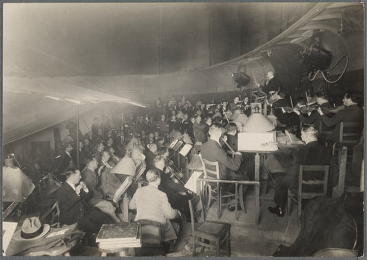 Arturo Toscanini conducting an orchestra