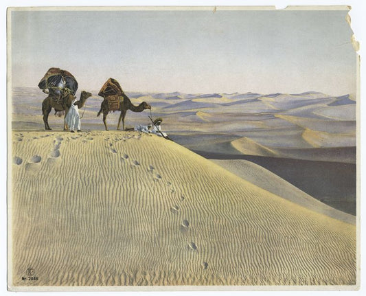 Men and camels in the desert.