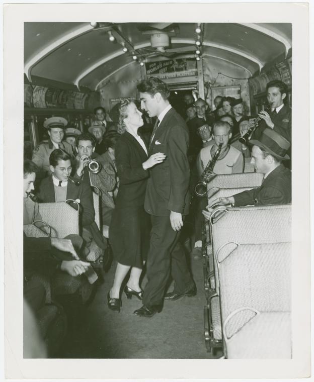 Amusements - Dance - Couple dancing in train car with band