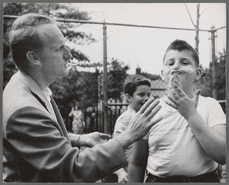 Actor Joseph Barr plays with children at the East River Park Amphitheatre during the run of The Taming of the Shrew
