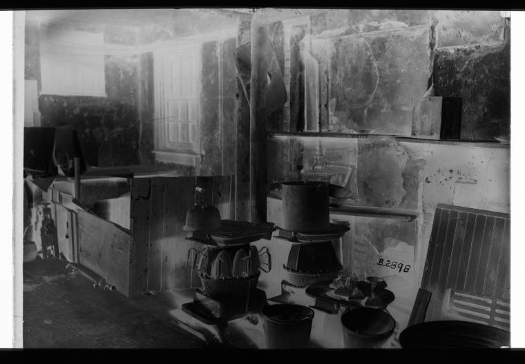 Approximately 10 irons on stove