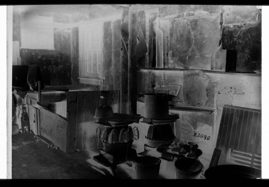 Approximately 10 irons on stove