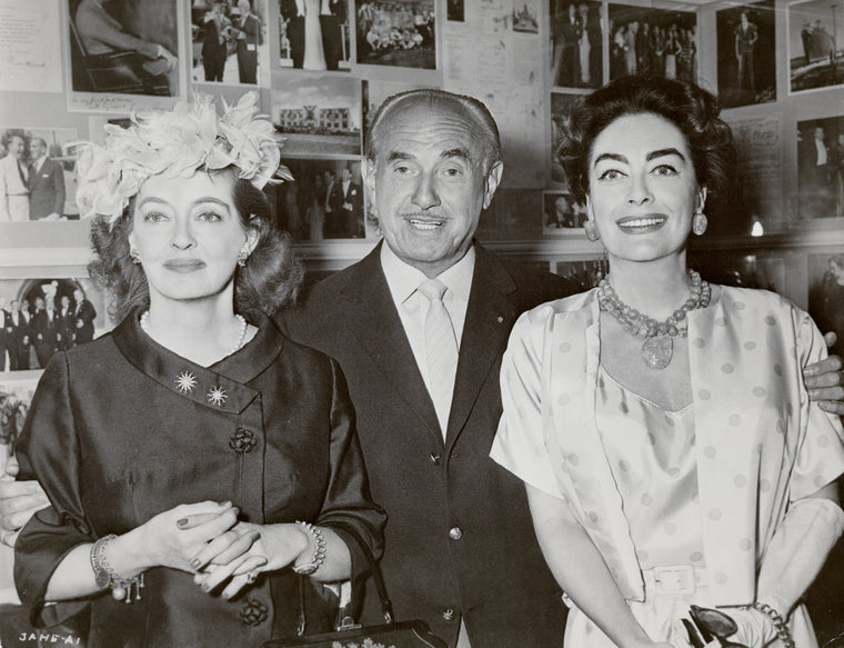 Bette Davis, Jack L. Warner and Joan Crawford during press conference for the motion picture Whatever Happened to Baby Jane?