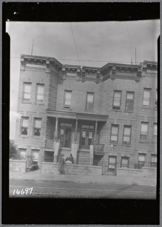 [Stone rowhouses; two women in front: 5211-5213 [street unknown] ]