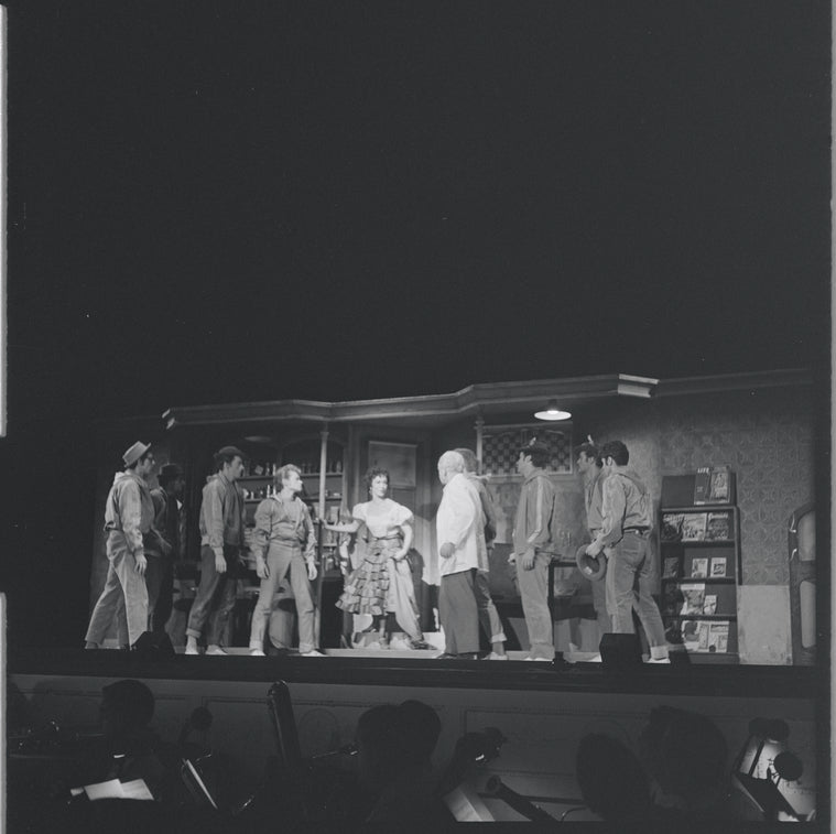 Chita Rivera with gang members in scene from the stage production West Side Story