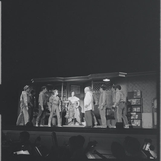 Chita Rivera with gang members in scene from the stage production West Side Story