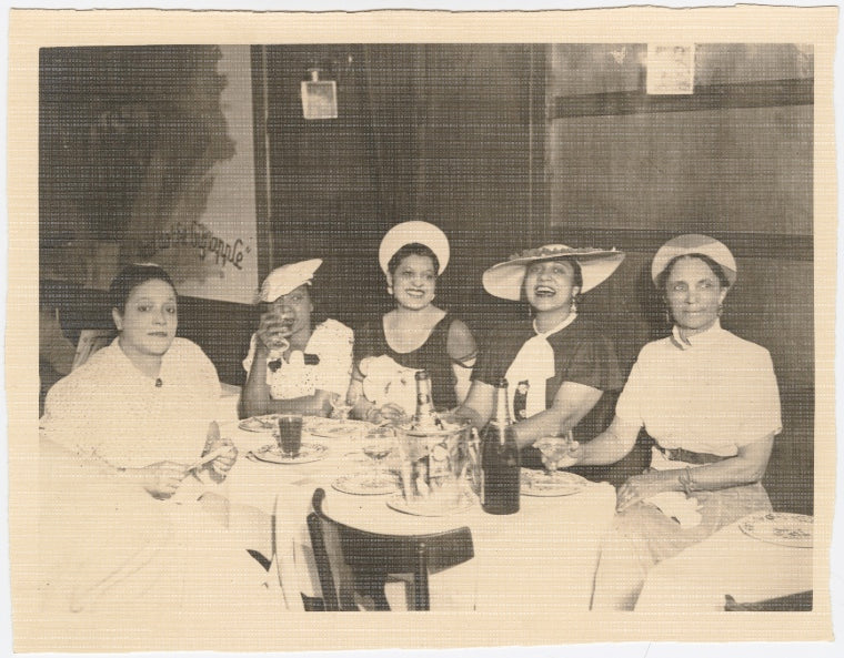 Ada "Bricktop" Smith (far left) seated at table with other women