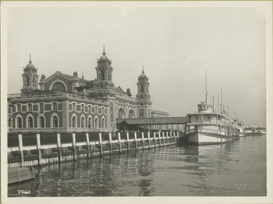 Immigrant Station, Ellis Island, with ferry docked at adjacent pier.