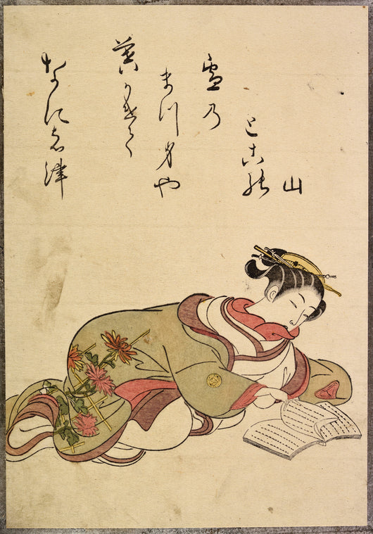 Reclining lady reading book