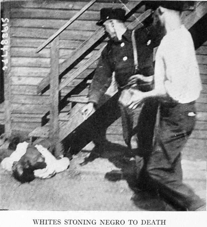 Whites stoning Negro to death