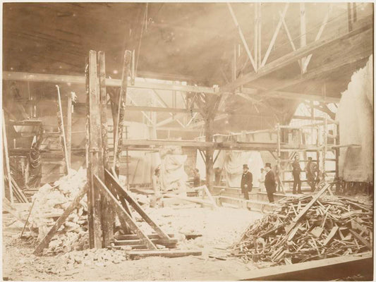 View of the workshop, with models of the Statue of Liberty in the background